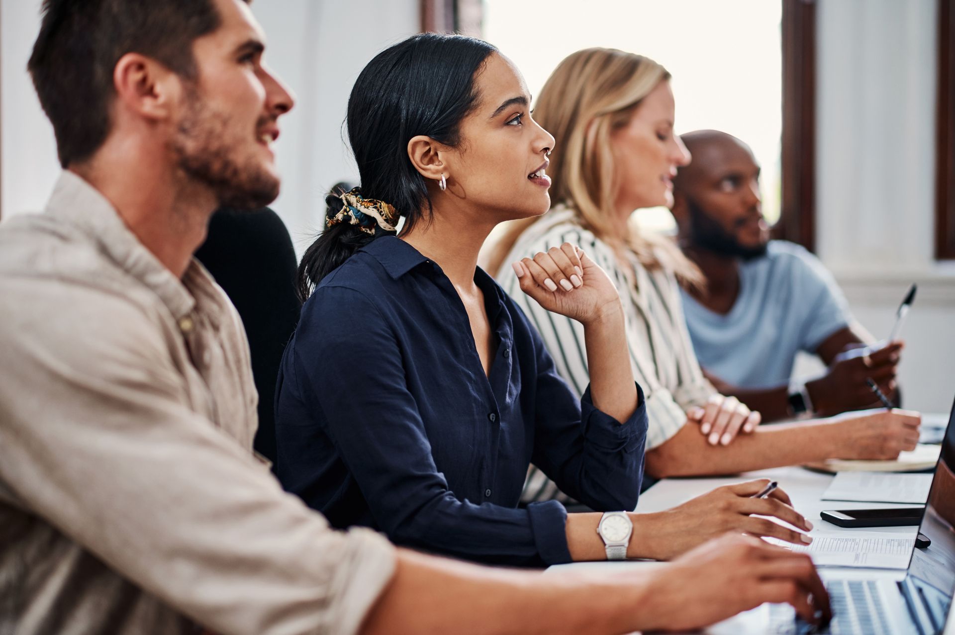 A group of diverse people seated at a table
