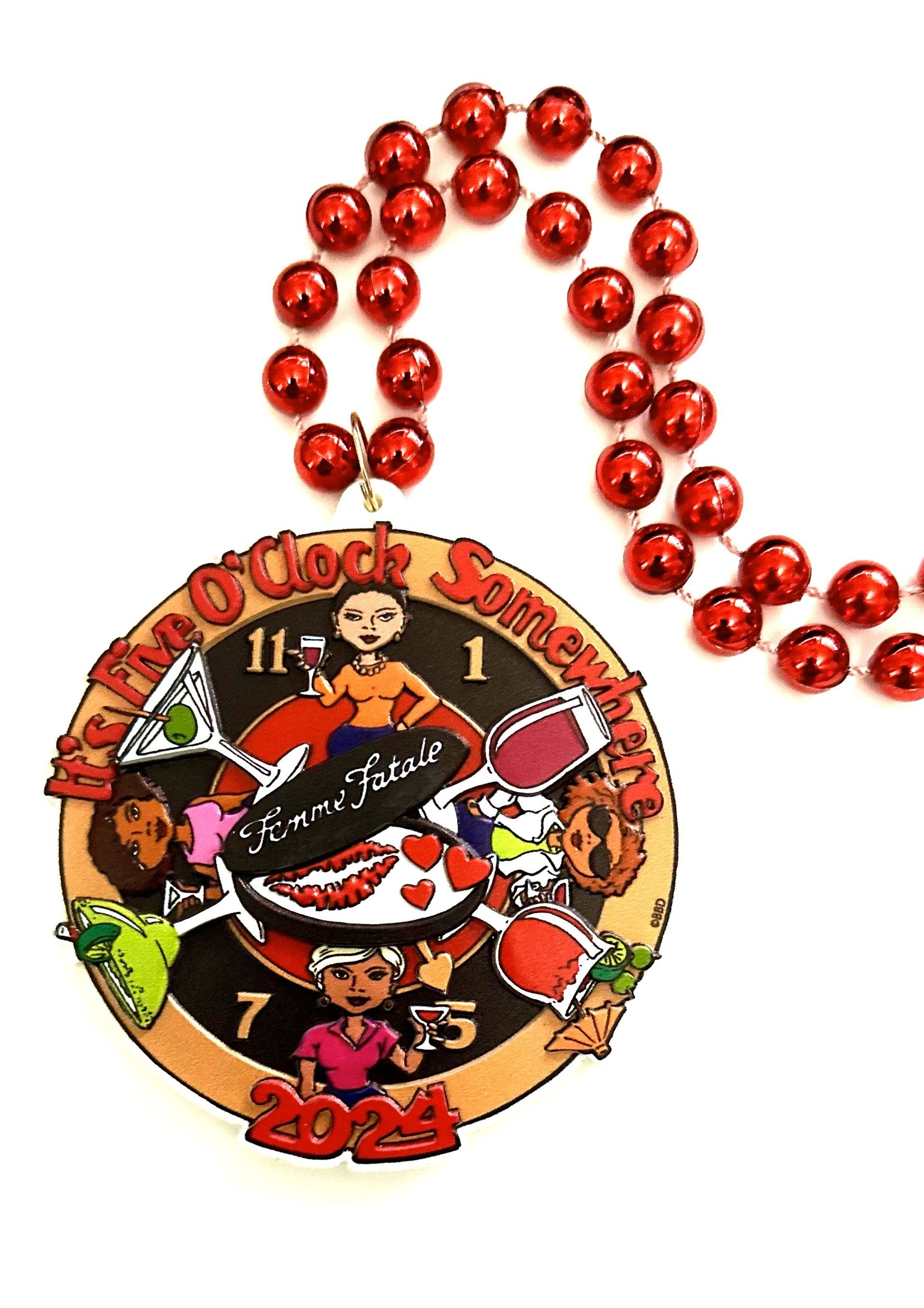 A necklace with red beads and a medal on it