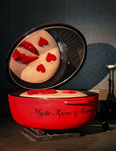 A red pot that says mystic manner of food on it