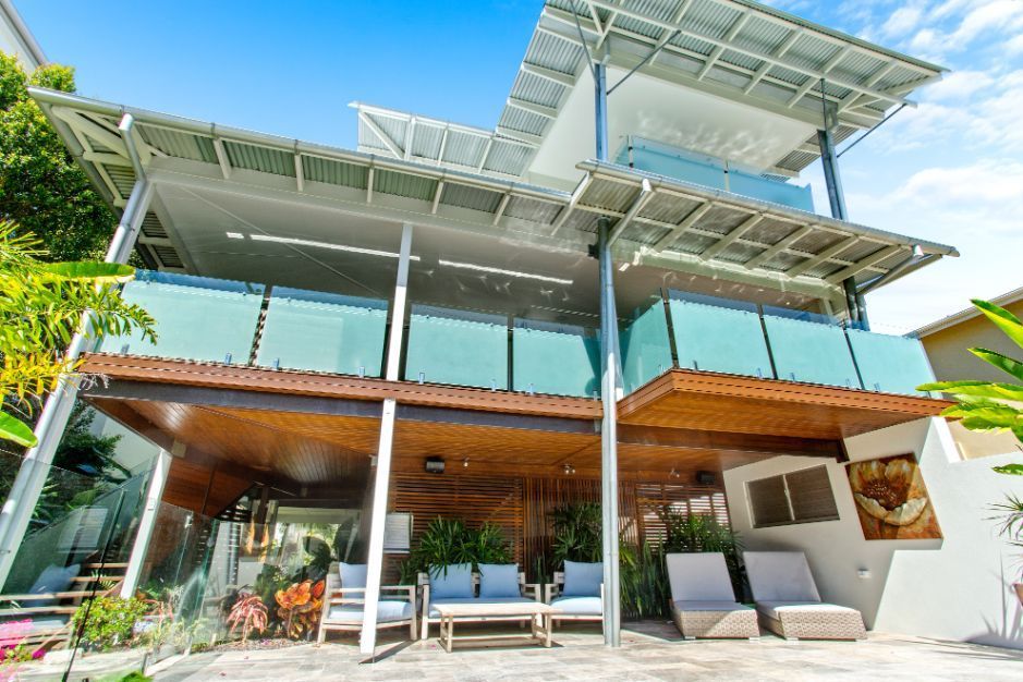 A Bathroom With a Walk in Shower With a Glass Door — Paul Cooper Homes In Noosa Heads, QLD