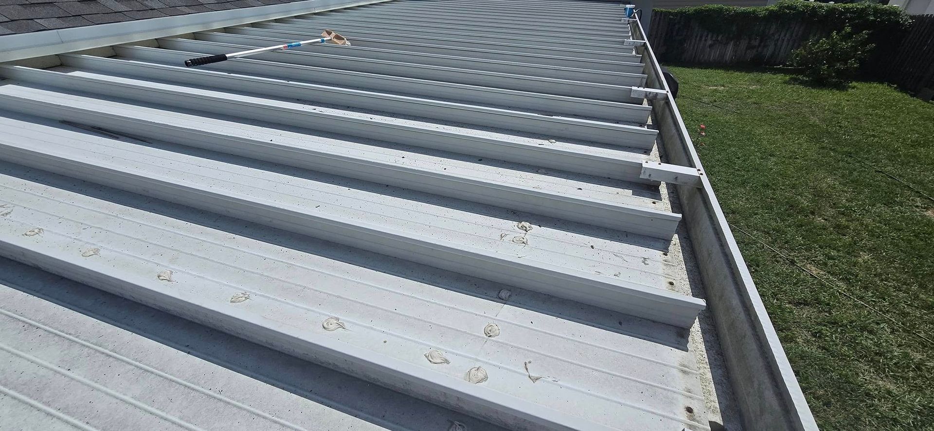 A close up of a roof with a gutter on it