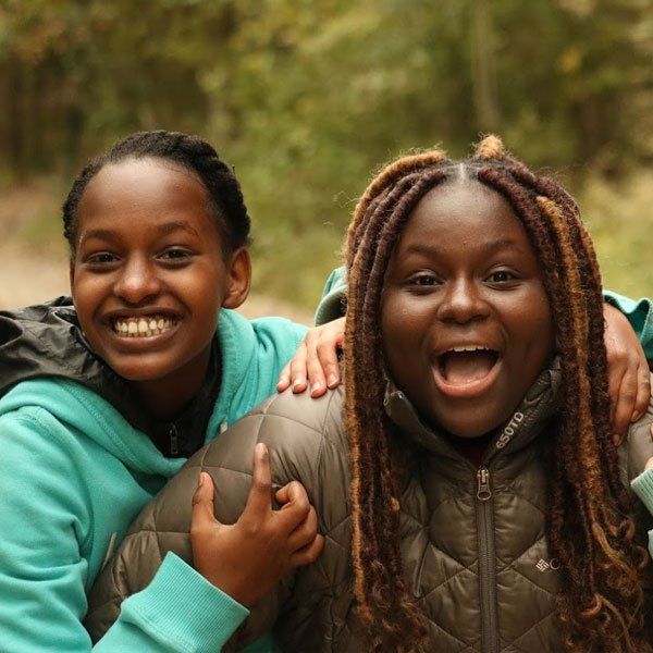 Two girls smiling