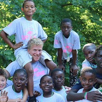 Group of youths and their camp counselor
