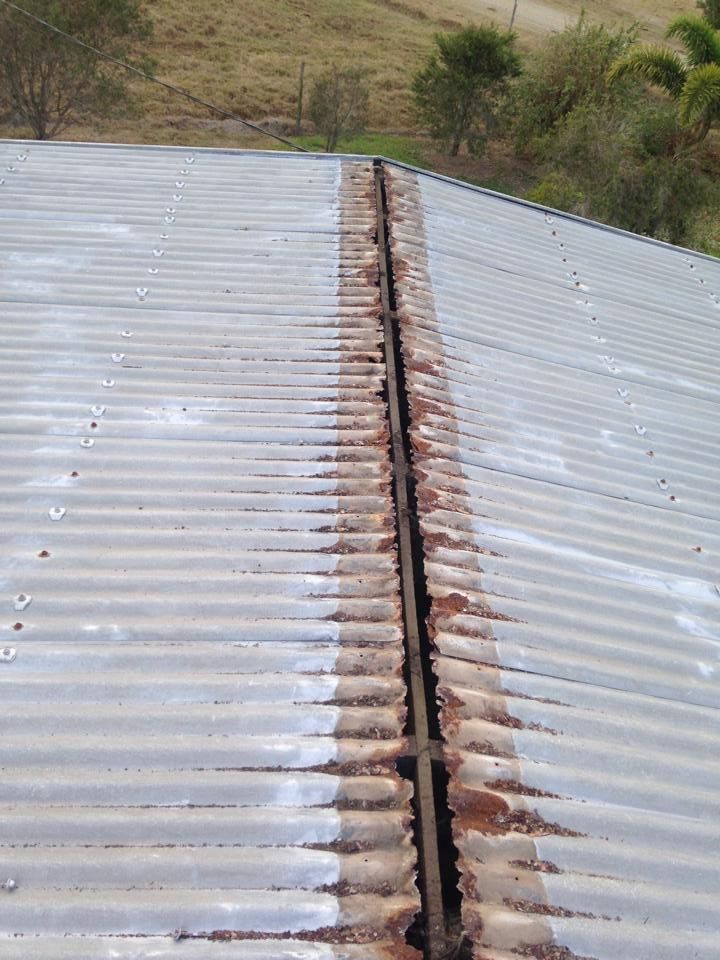 Corrugated Metal Roof Ridge With Rust; Outdoors โ LJG Plumbing In Sarina, QLD