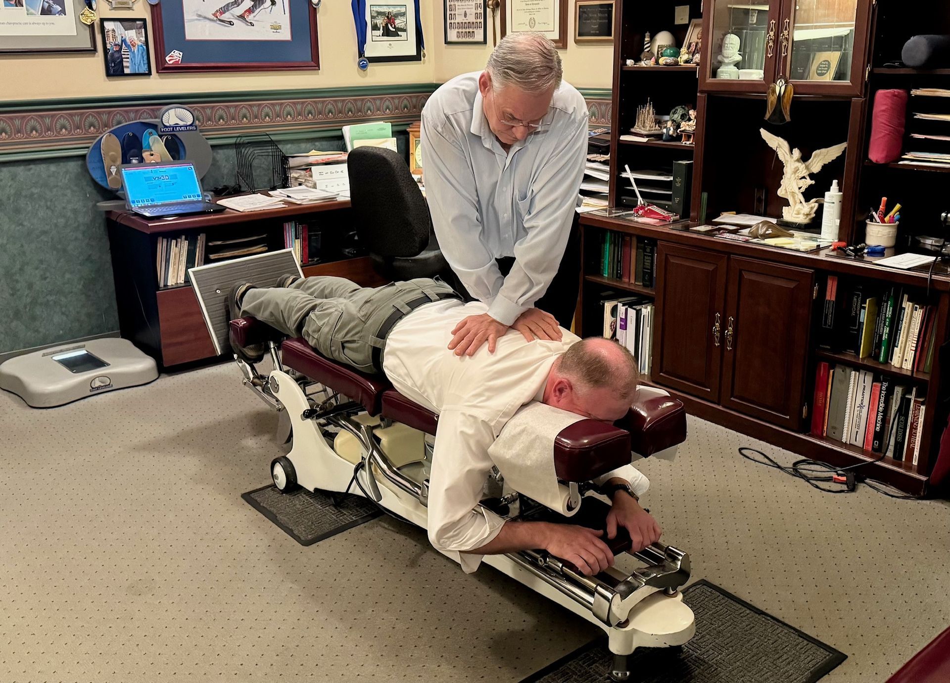 Chiropractor Fixing Elder Man's Spine — Winchester, KY  — Miller  Chiropractic Centre Inc PSC