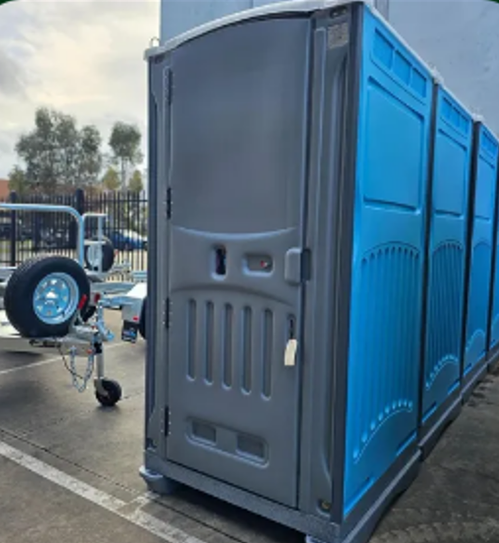A blue plastic portable toilet, showcasing portable toilet hire. A blue plastic portable toilet, showcasing portable toilet hire.