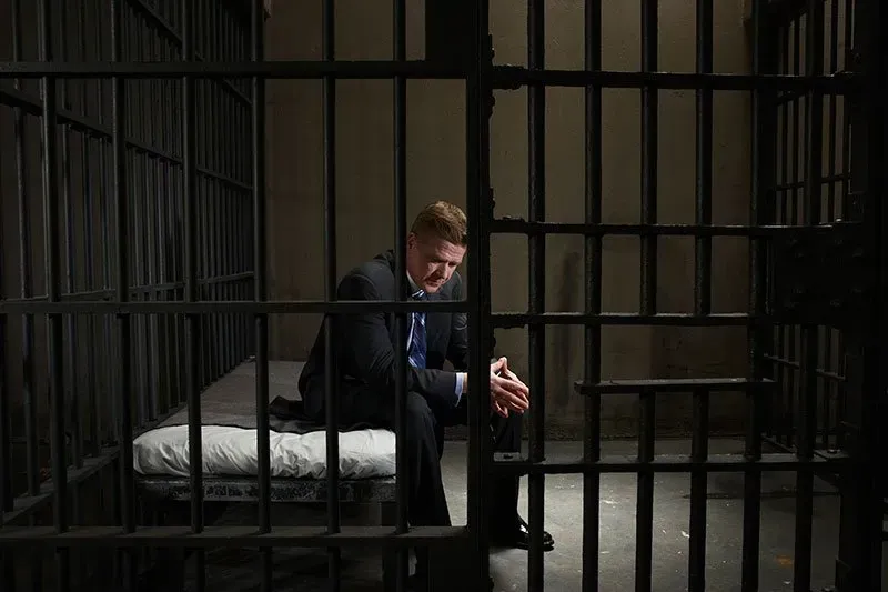 Man sitting on the bed inside the jail — San Antonio, TX — A-Action Bail Bonds Man sitting on the bed inside the jail — San Antonio, TX — A-Action Bail Bonds