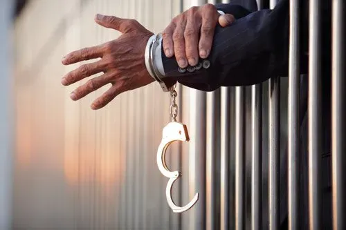 One hand with handcuff — San Antonio, TX — A-Action Bail Bonds One hand with handcuff — San Antonio, TX — A-Action Bail Bonds