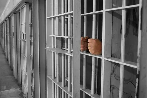 Hands on cell bars — San Antonio, TX — A-Action Bail Bonds Hands on cell bars — San Antonio, TX — A-Action Bail Bonds