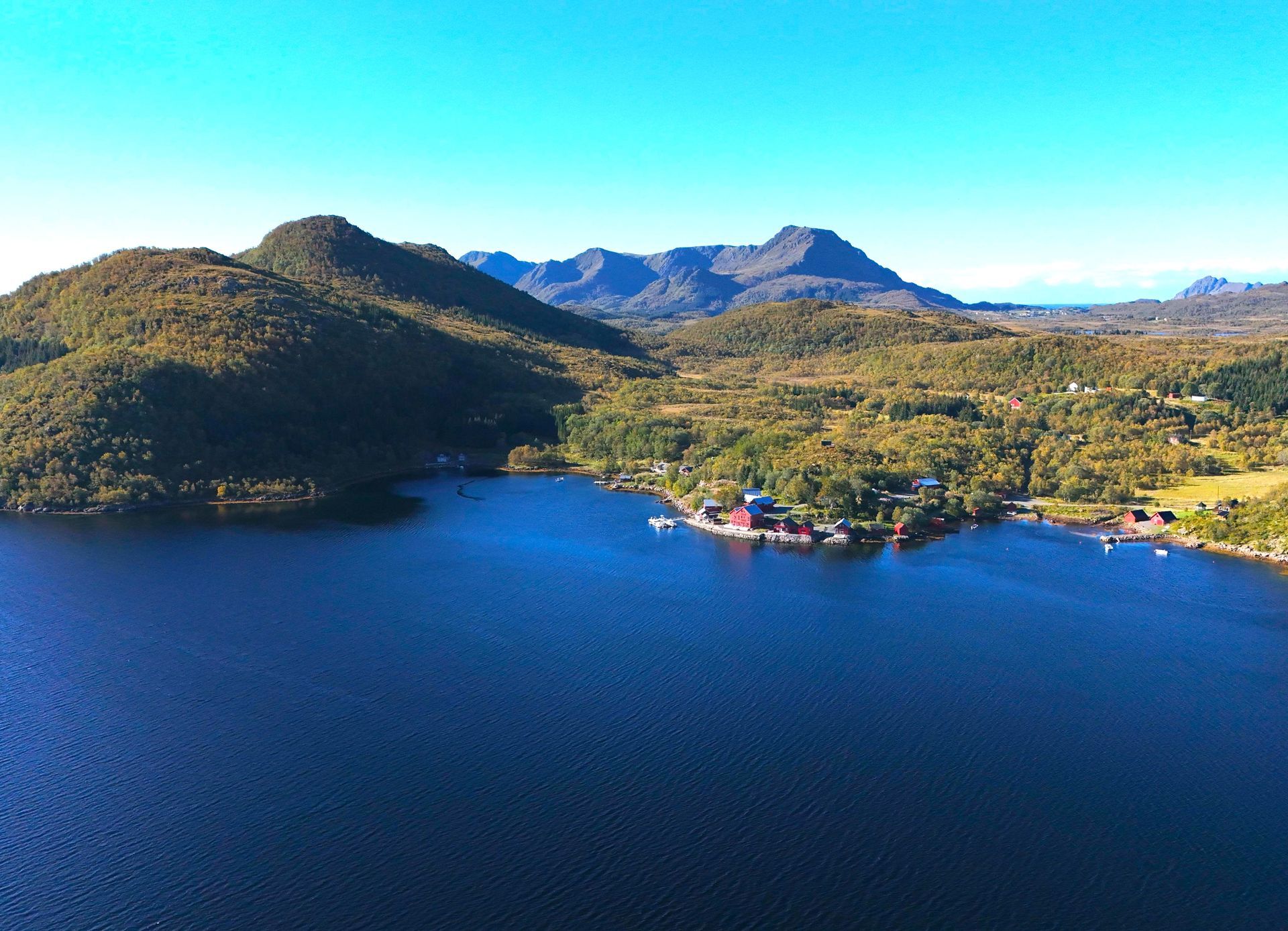 Remote bay, with fjord side red house