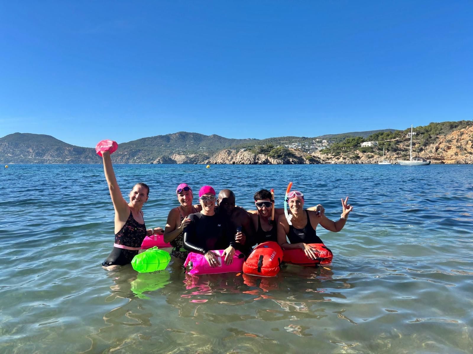 group of women wild swimming in ibiza
