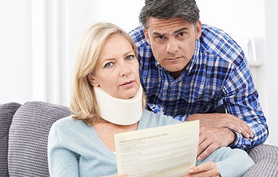 Personal Injury — Man With Broken Hand Writing On Paper in Hollywood, FL