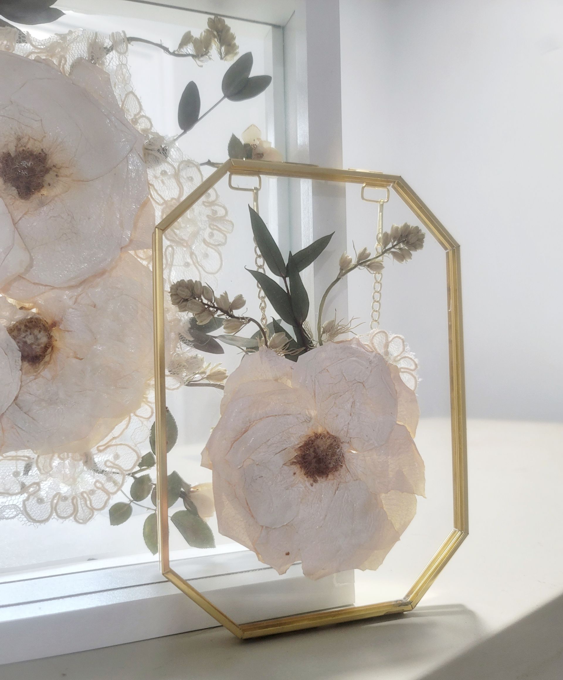 floral preservation in gold frame