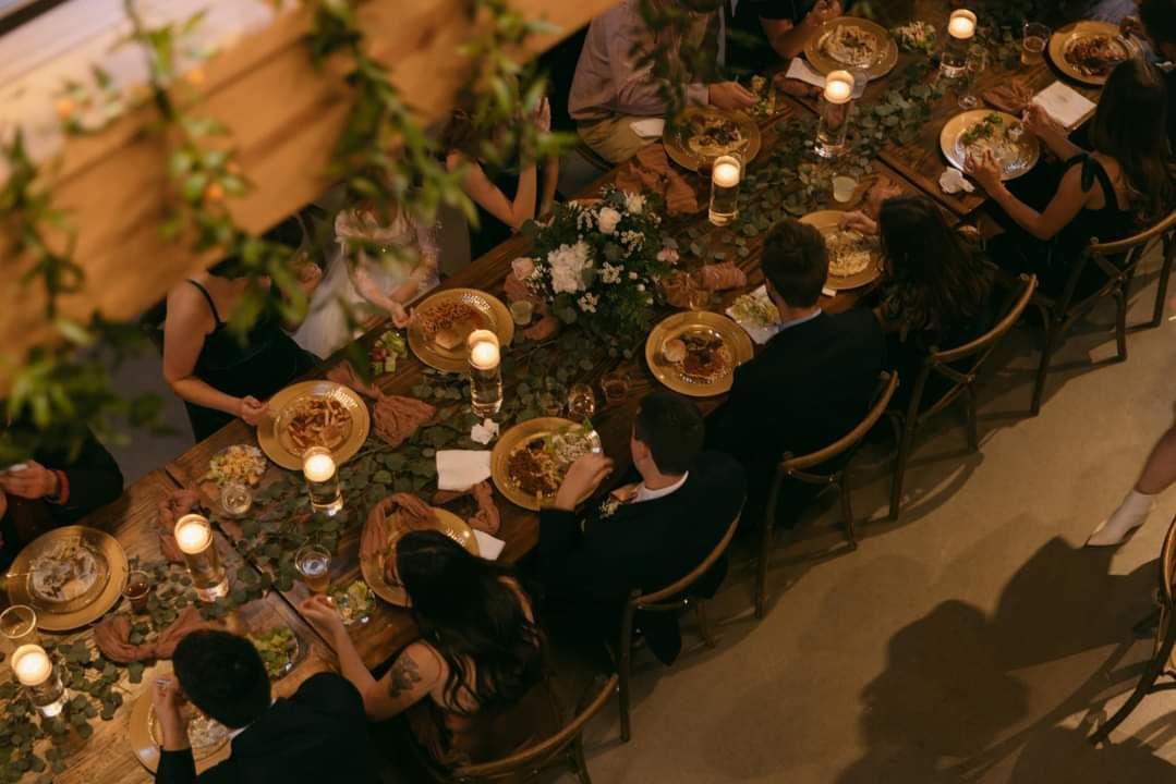 wedding guests dining and long wedding reception table