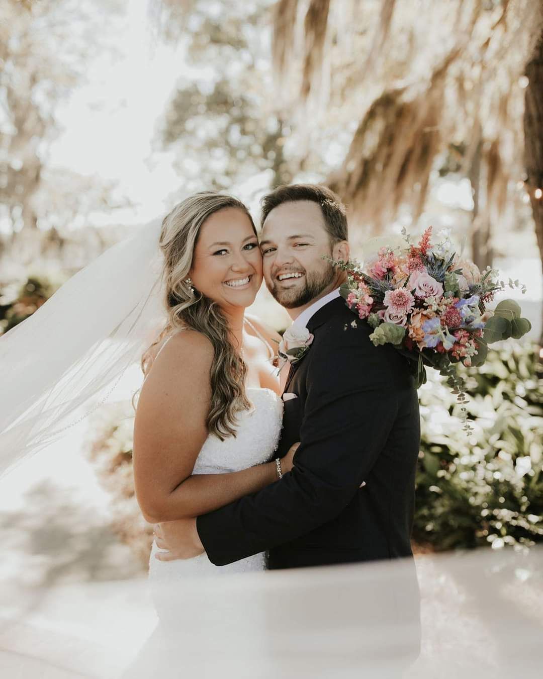 bride and groom smiling