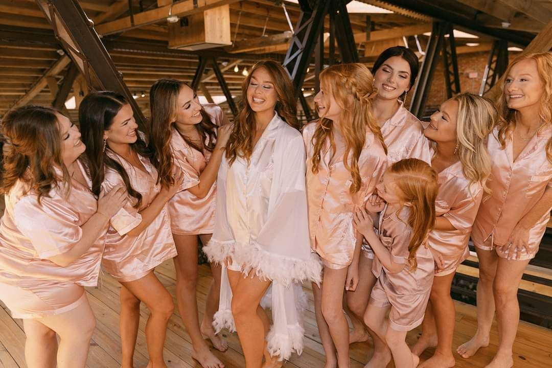 bride with bridesmaids in silk robes