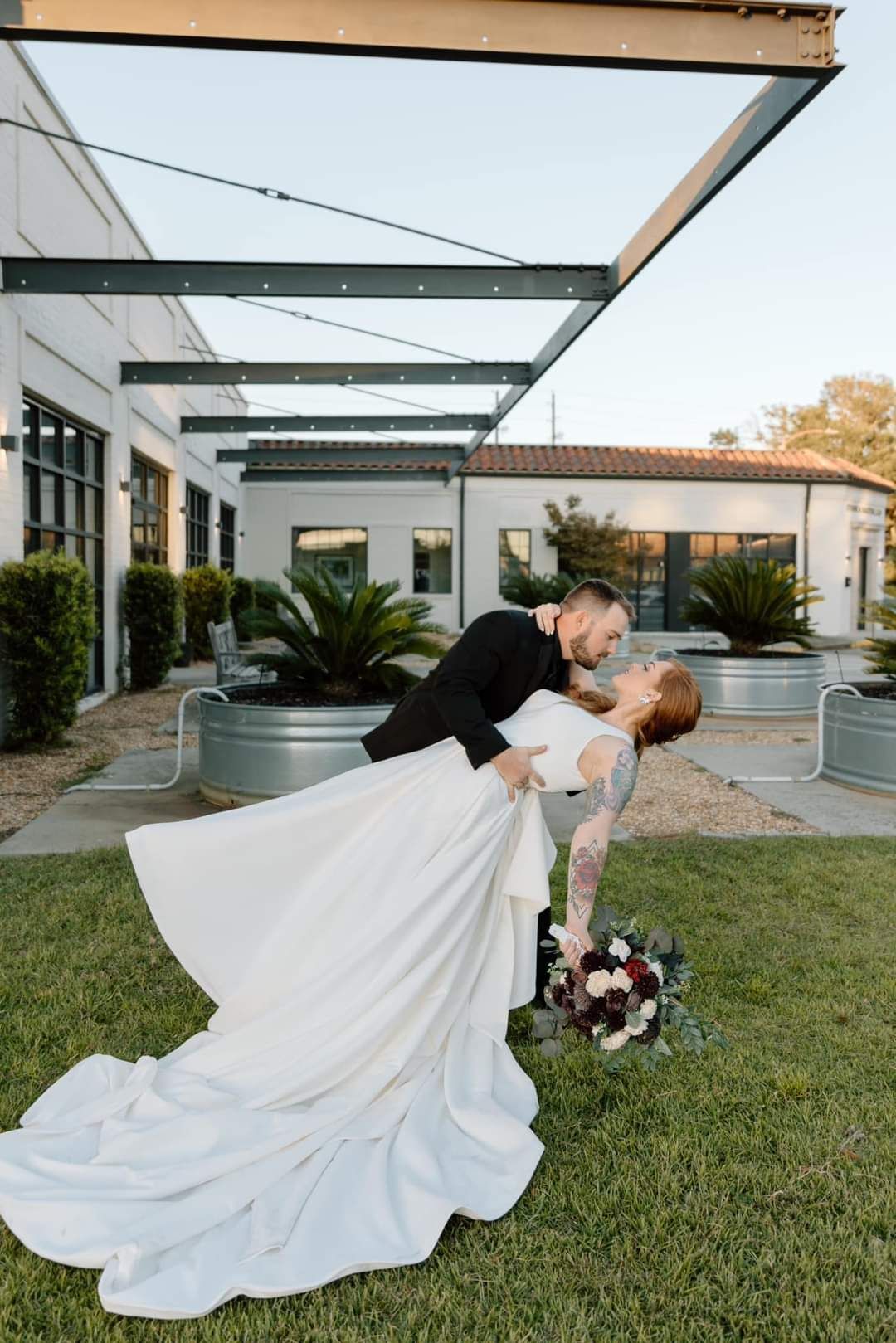 groom dipping bride