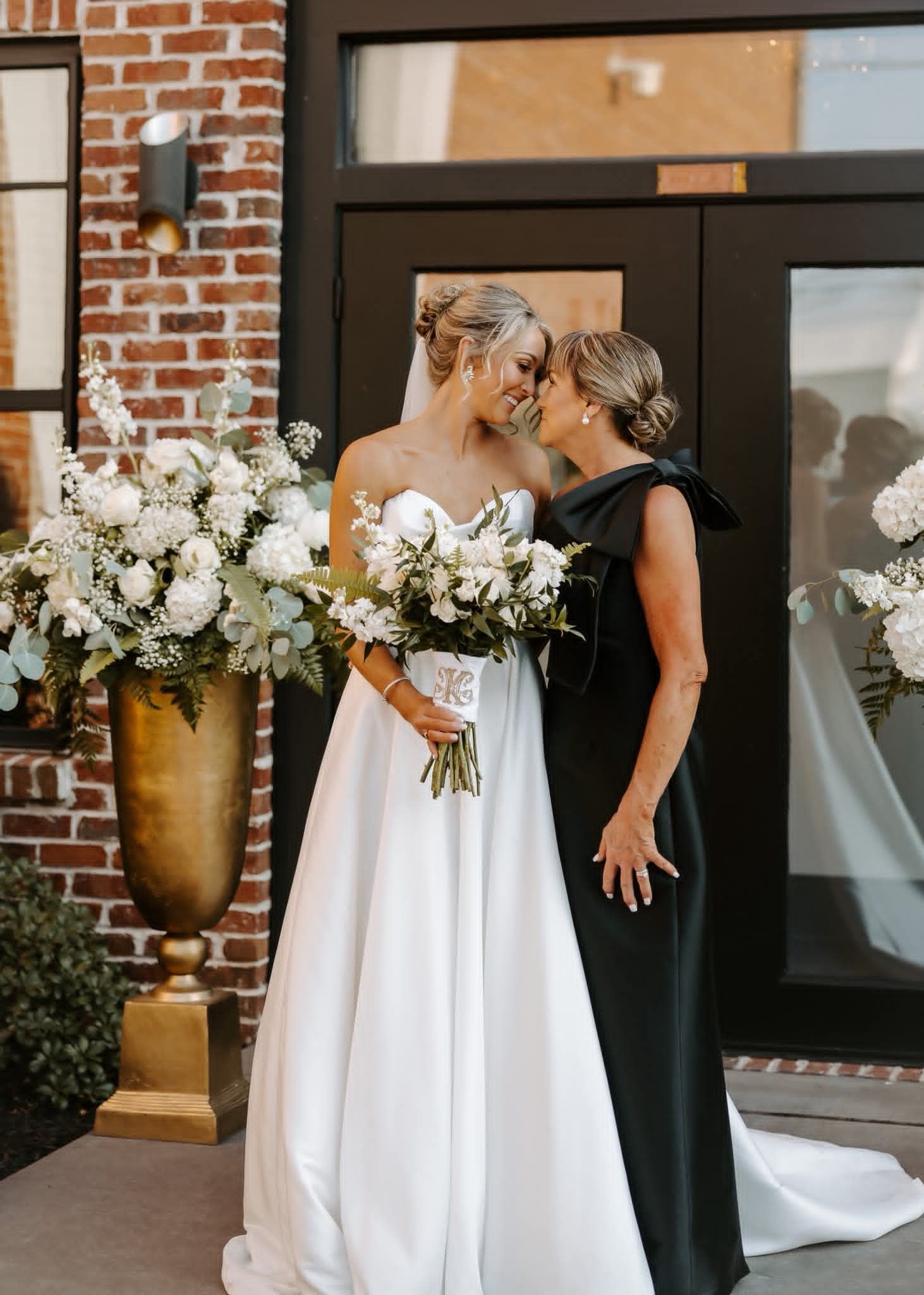 bride and mother embracing