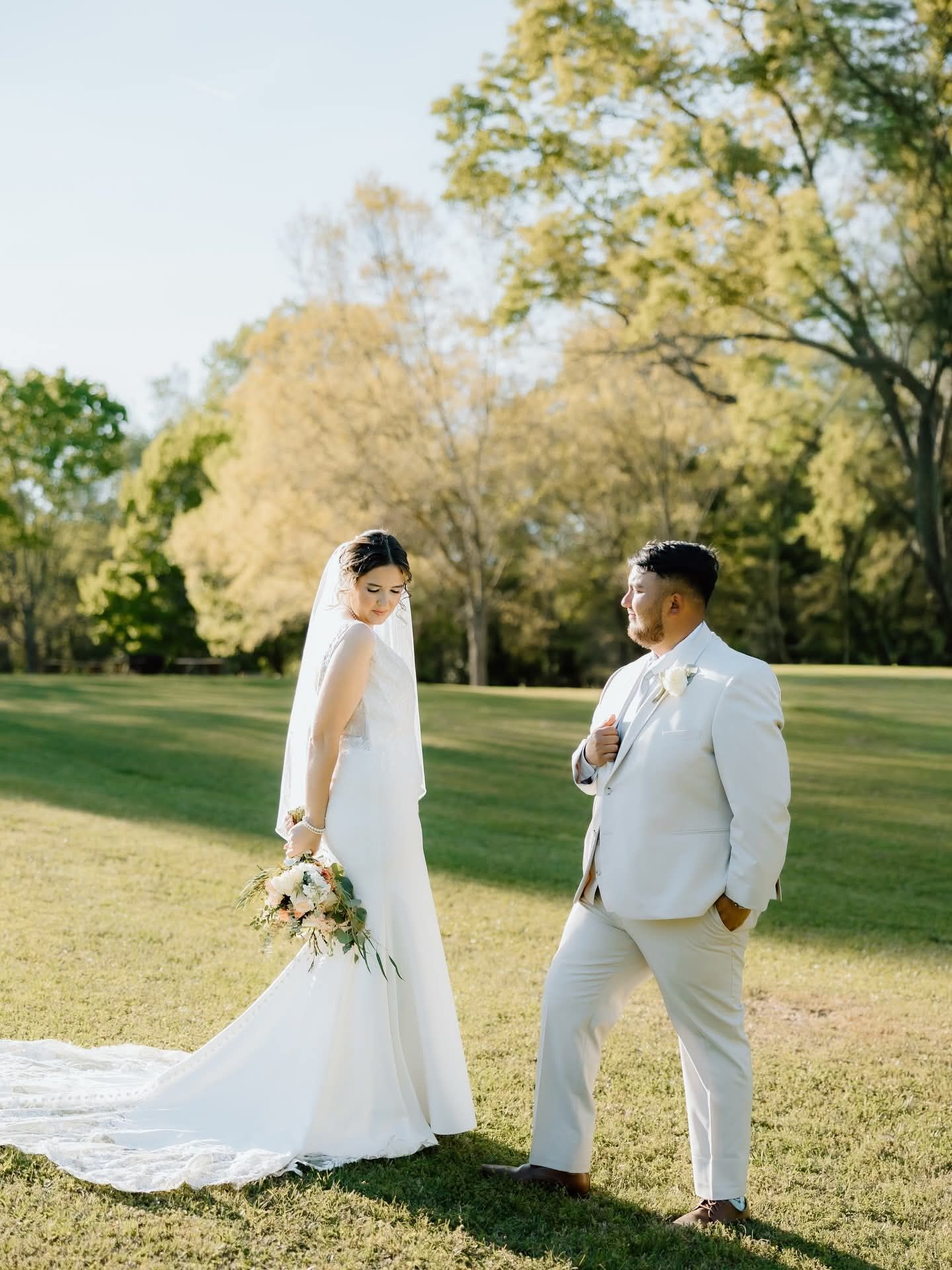 candid shot of bride and groom outdoors