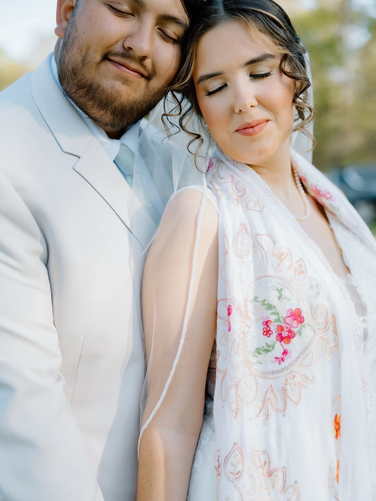 groom embracing bride