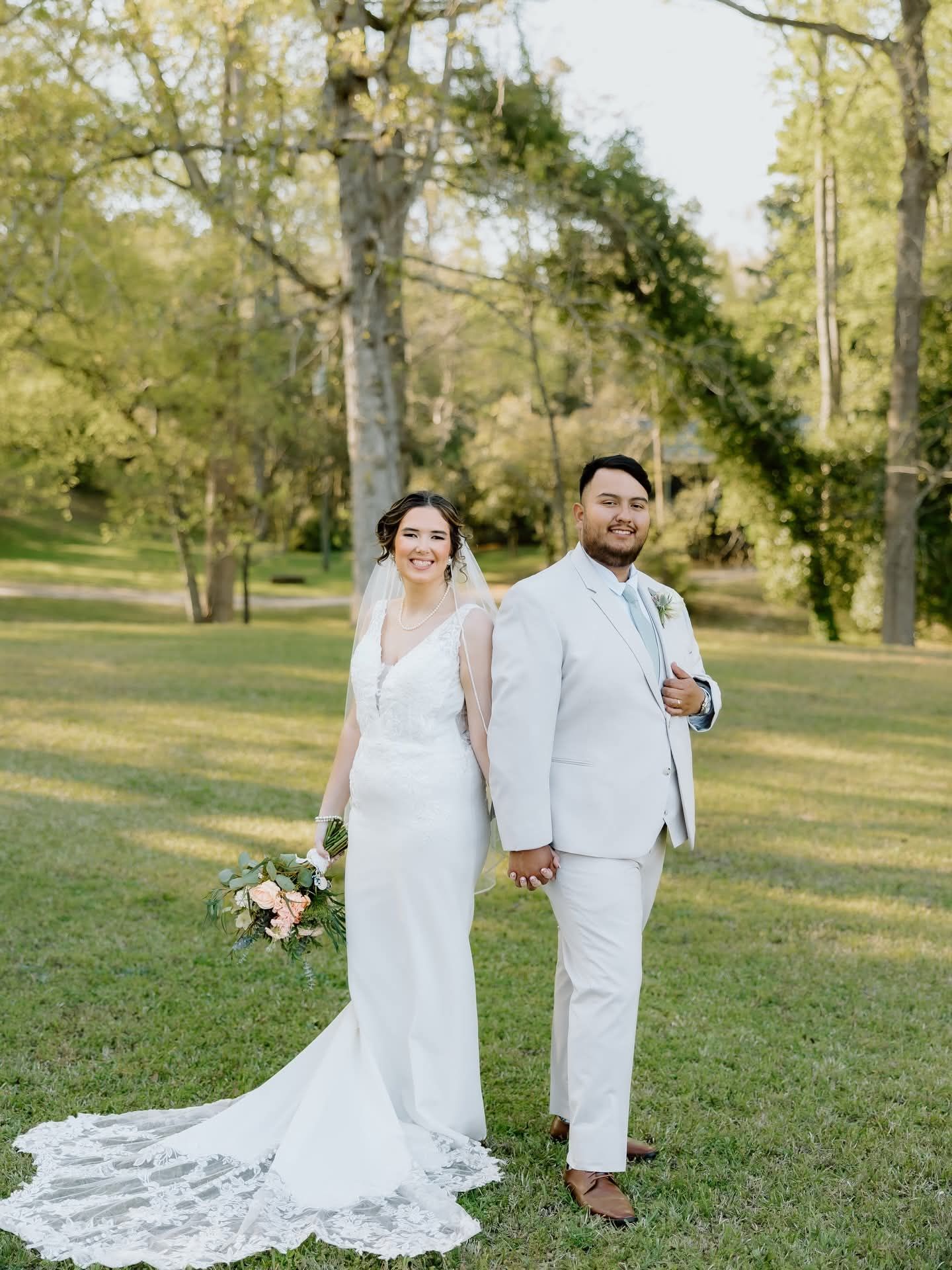 bride and groom holding hands