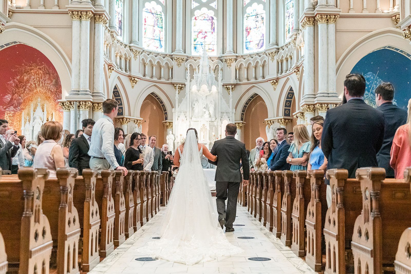 bride and groom walking down aisle in traditonal church wedding