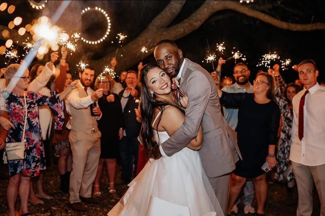 bride and groom embracing during sparkler exit
