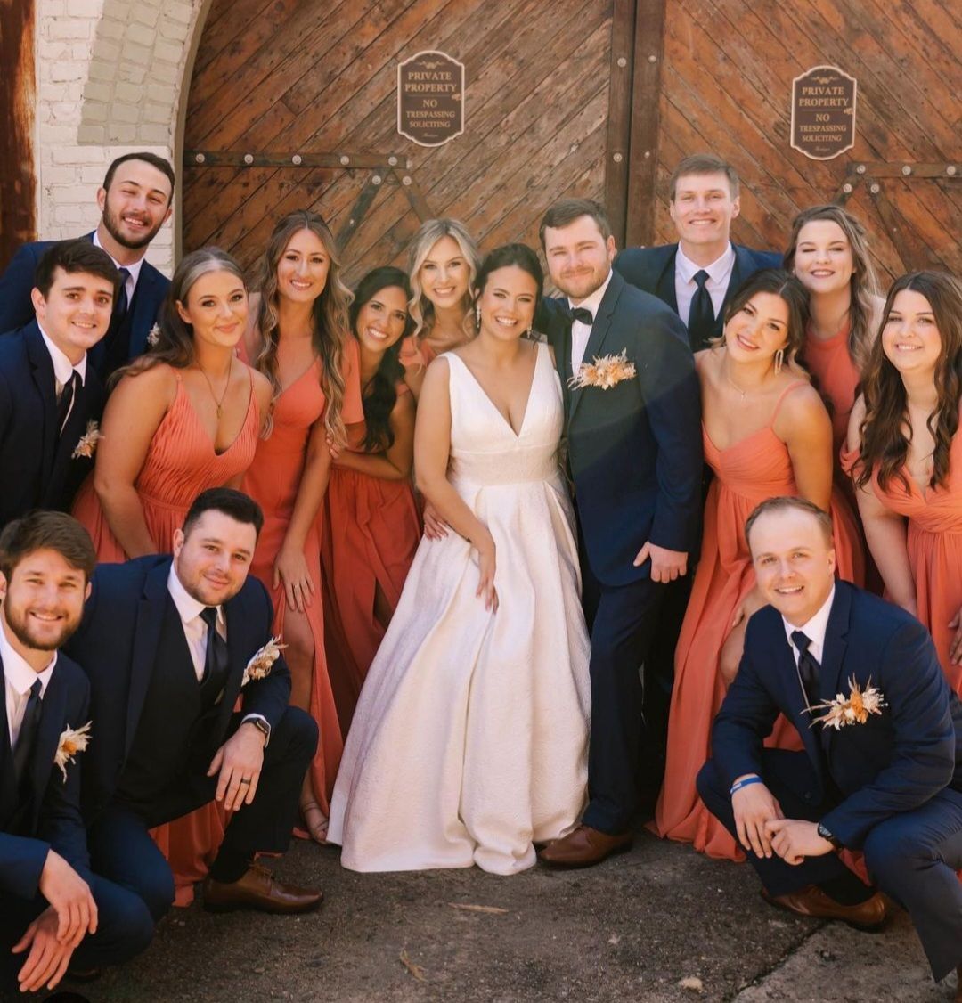 bride and groom with wedding party