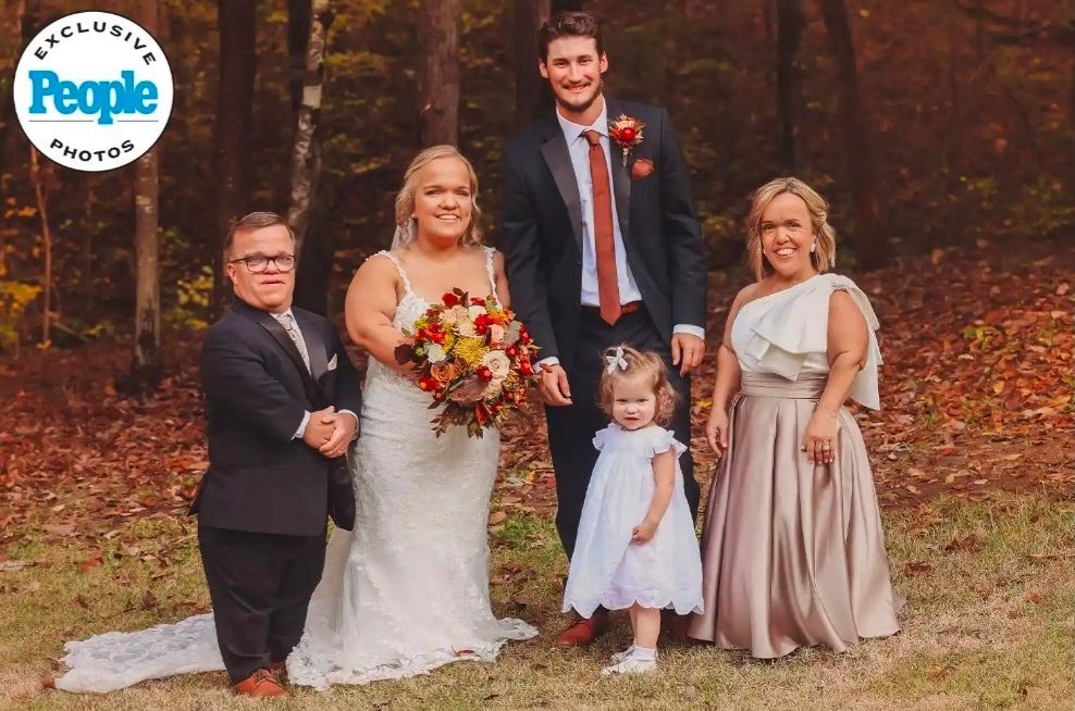 bride and groom with family