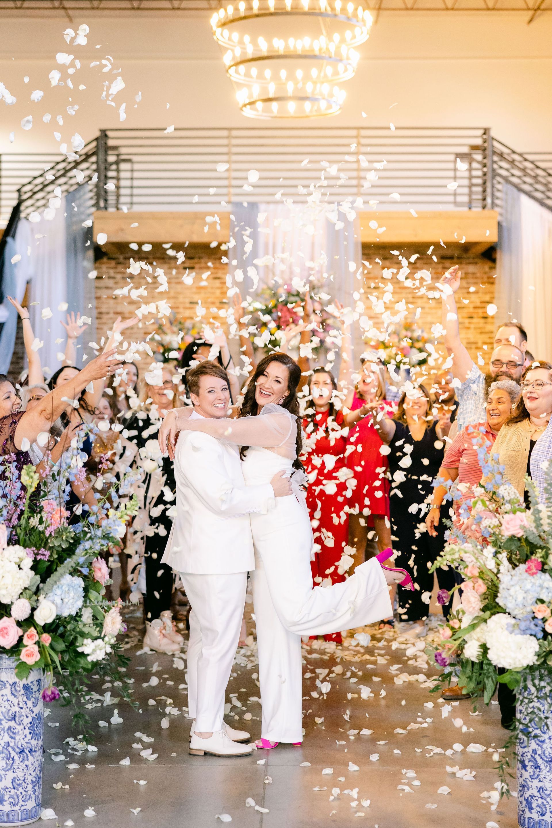couple embracing surrounded by flower petals