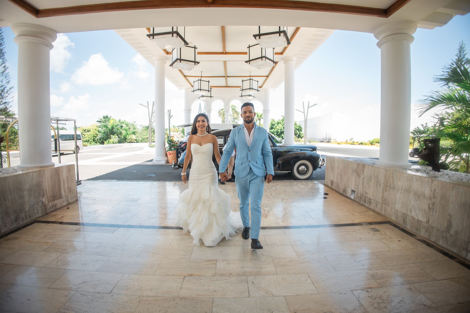 bride and groom arriving at resort for destination wedding