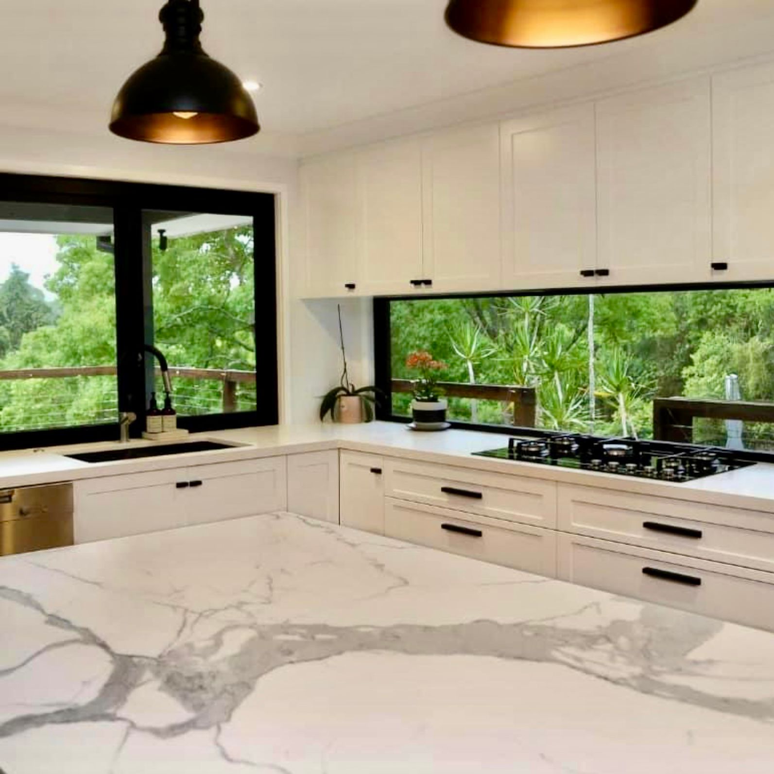 A Kitchen With Wooden Cabinets and a Large Window — Kenross Kitchens In Ettalong Beach, NSW