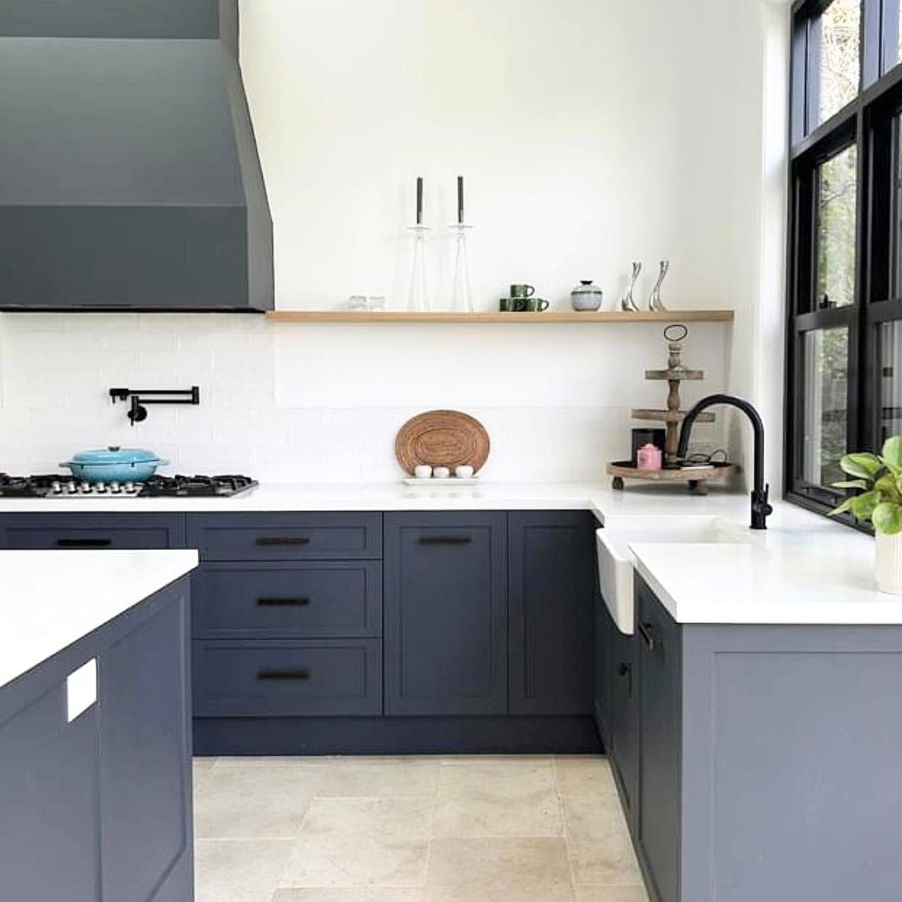 A Kitchen With Blue Cabinets, White Counter Tops, a Sink and a Stove — Kenross Kitchens In Ettalong Beach, NSW