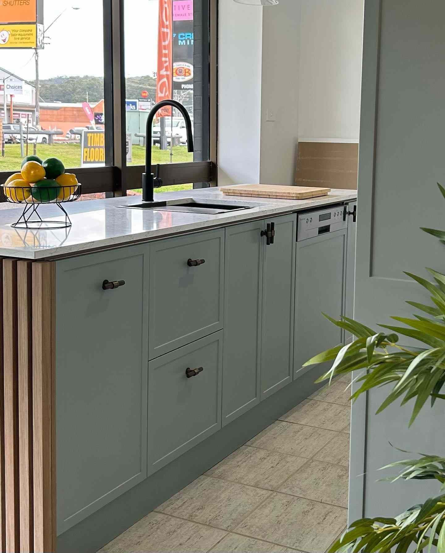 A Kitchen With a Sink and a Bowl of Lemons on the Counter — Kenross Kitchens In Wyong, NSW