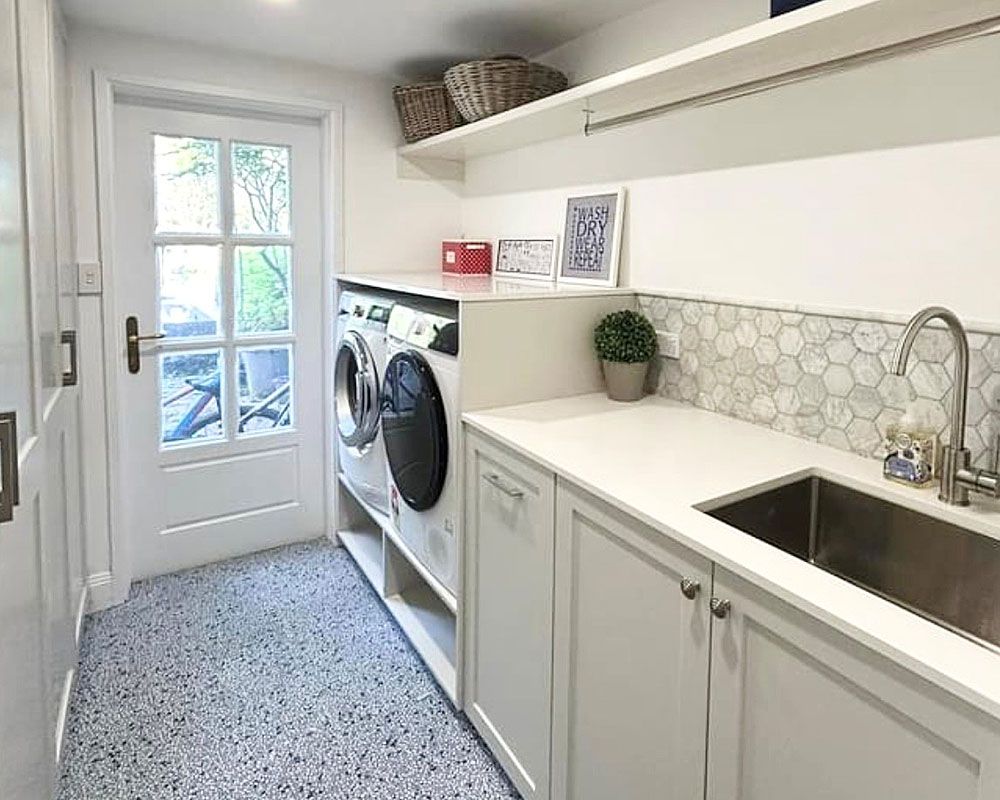 A Laundry Room With a Washer and Dryer and a Sink — Kenross Kitchens In Avoca Beach, NSW