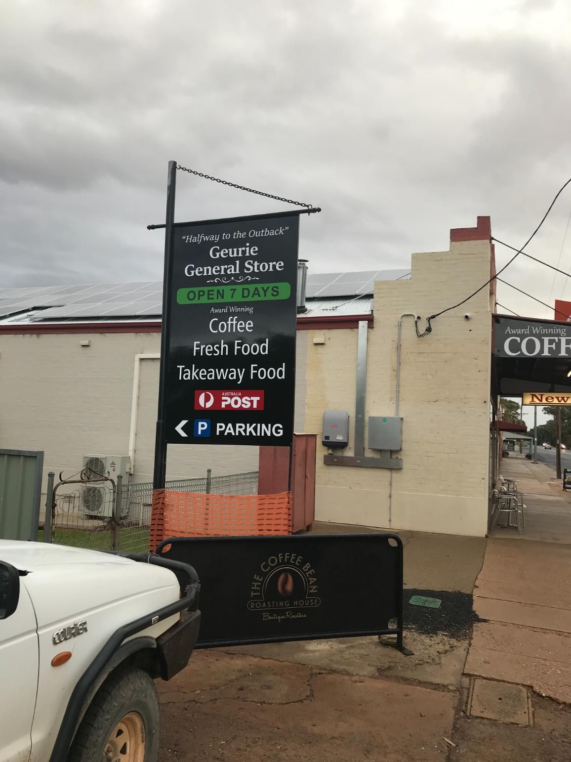 A Coffee Shop With A Red Phone Booth In Front Of It — Geurie General Store In Geurie, NSW