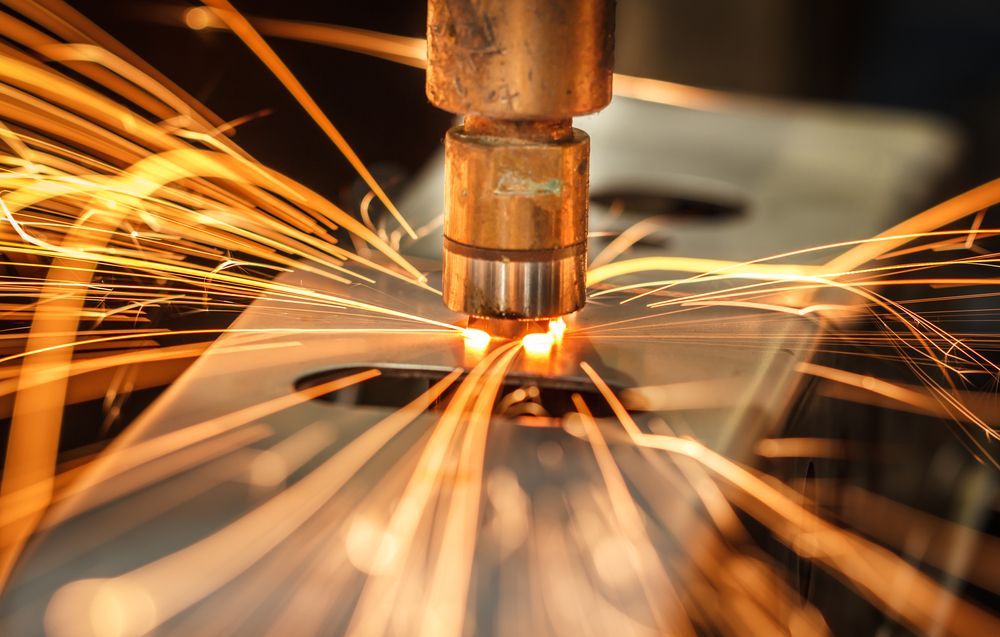 A Close Up of a Machine Cutting a Piece of Metal — Barry Smith Engineering Pty Ltd in Coffs Harbour, NSW