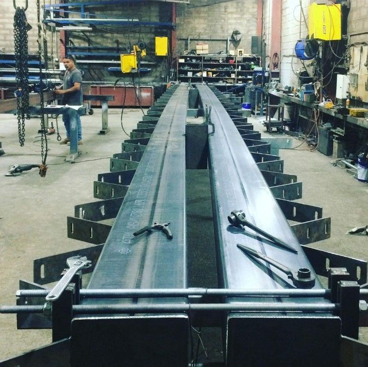 A Man is Working on a Piece of Metal in a Factory — Barry Smith Engineering Pty Ltd in Coffs Harbour, NSW