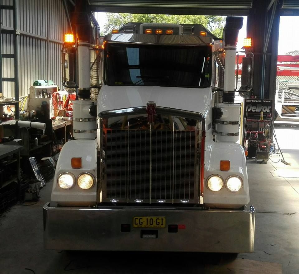 White Semi-truck Parked in a Garage, Facing Forward — Auto Watt in Kelso, NSW