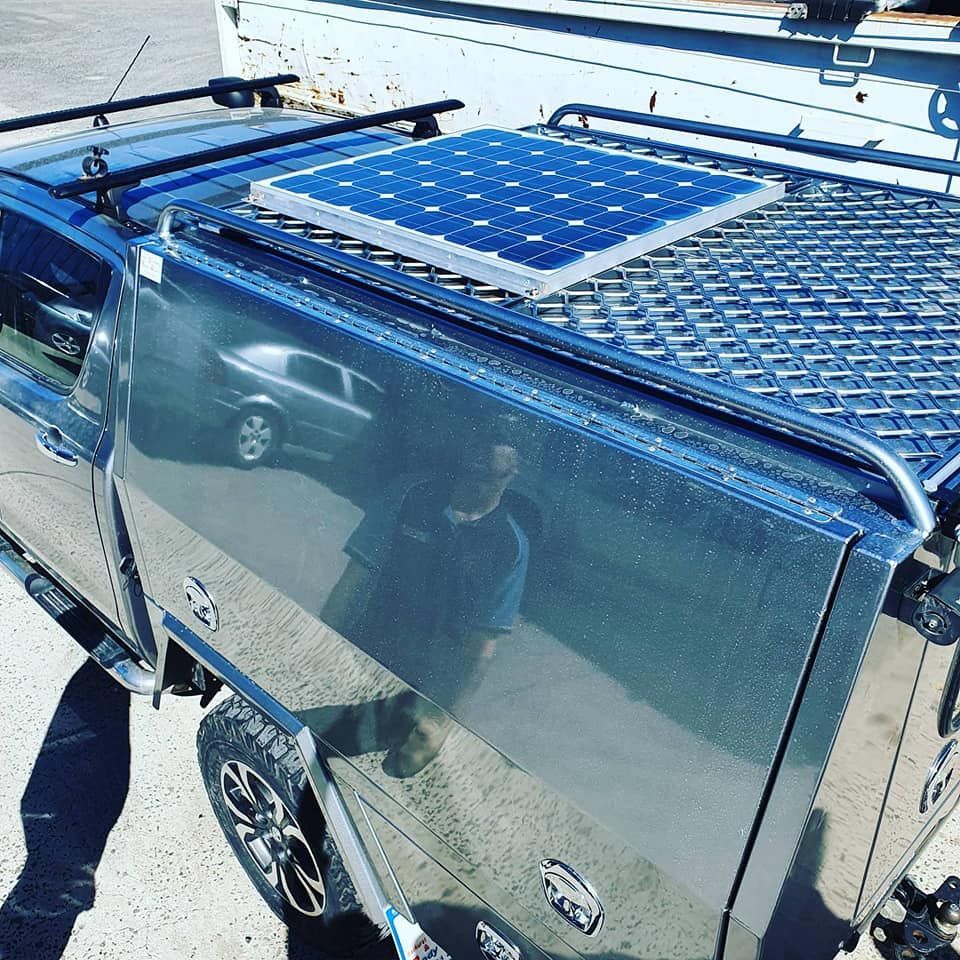 Solar Panel Mounted on Top of a Silver Utility Truck Bed — Auto Watt in Kelso, NSW