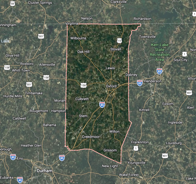 Satellite map showing a forested area outlined by a red square boundary on a rural landscape.