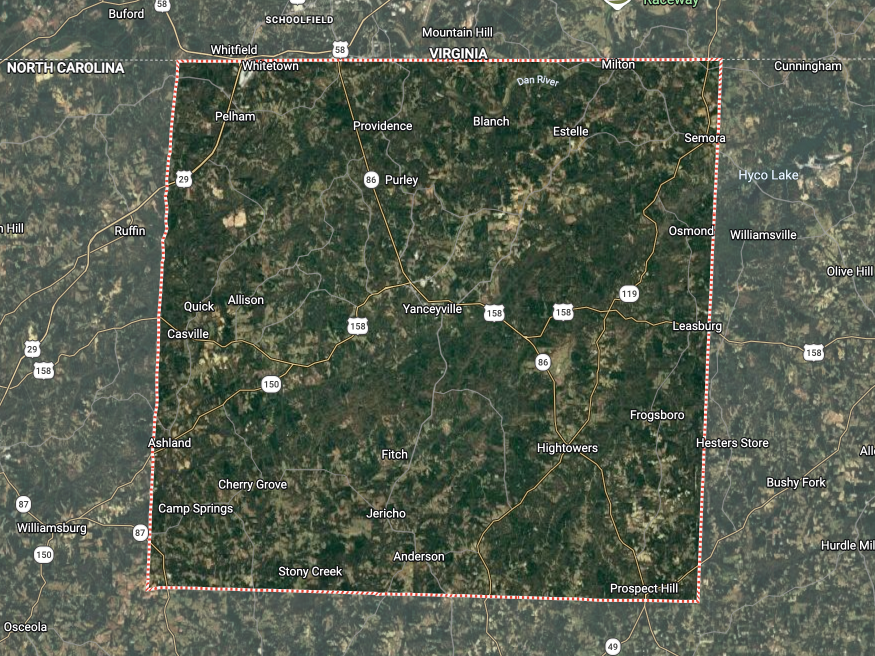 Satellite map showing a forested area outlined by a red square boundary on a rural landscape.