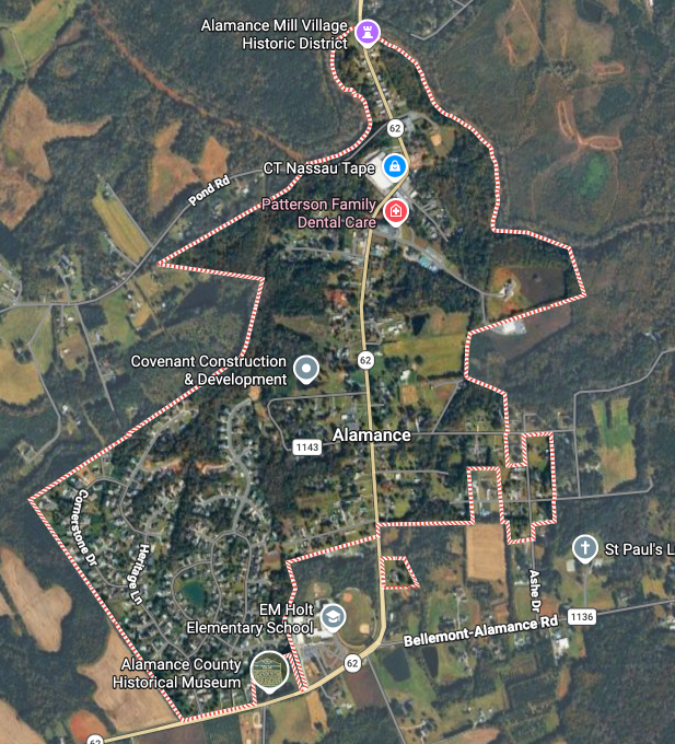 Satellite map showing a forested area outlined by a red square boundary on a rural landscape.