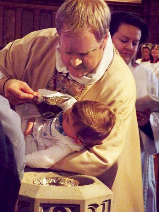 Pastor Charlie Hamill conducting a Child Baptism ceremony