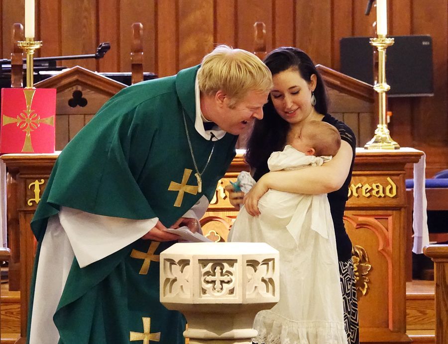 Pastor Charlie Hamill conducting an Infant Baptism ceremony
