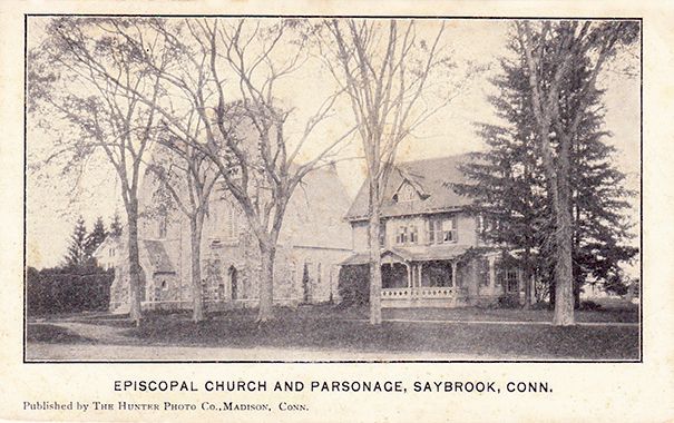 Historic black & white picture of Grace Episcopal Church & Parsonage in Old Saybrook, Connecticut, flanked by trees.
