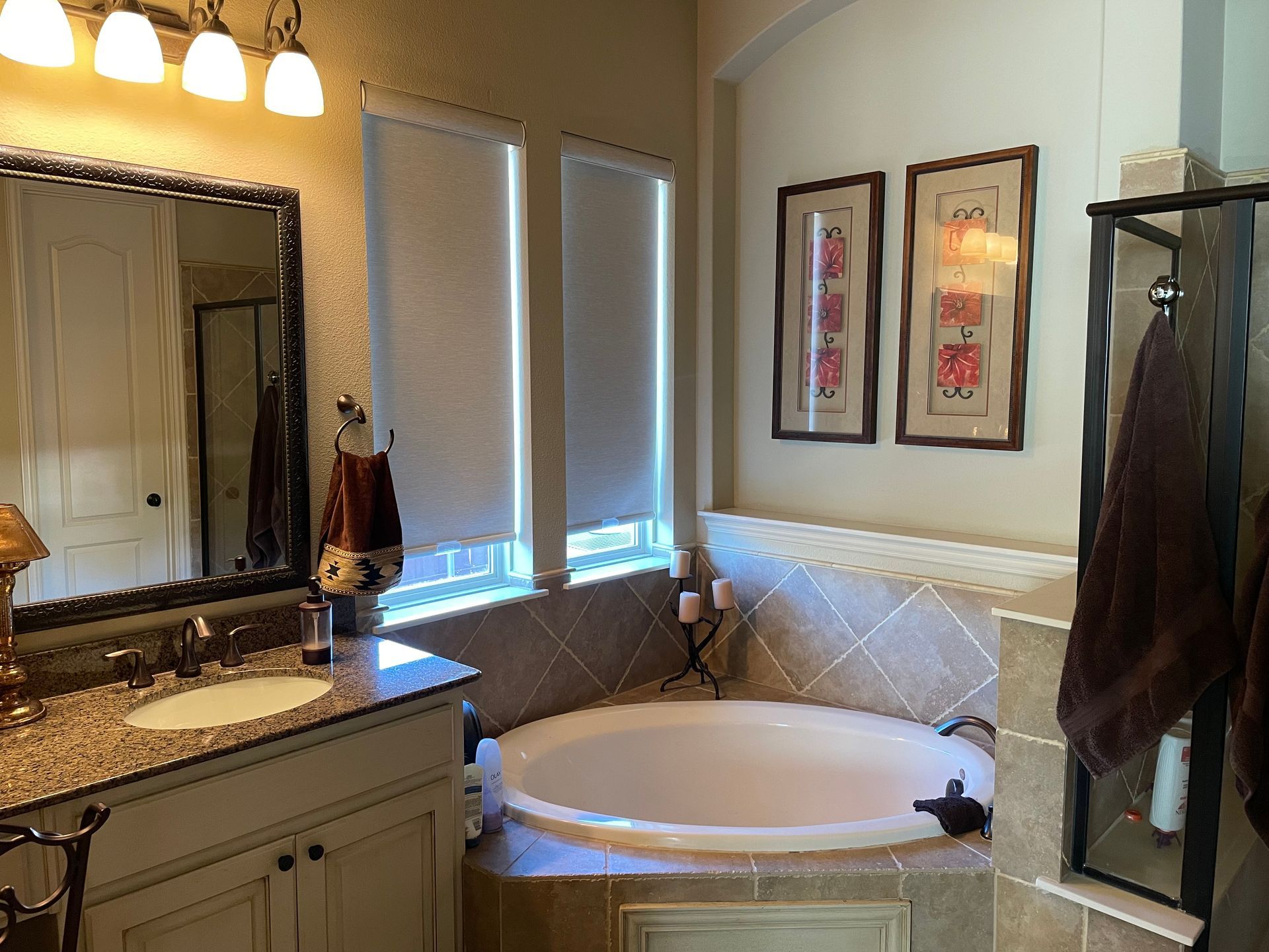 A bathroom with a jacuzzi tub and a sink