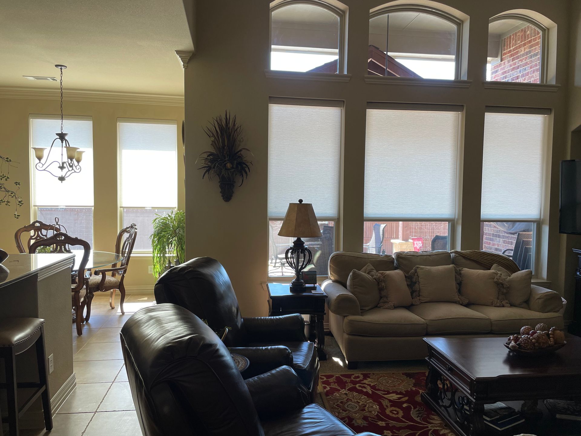 A living room with a couch a chair and a coffee table