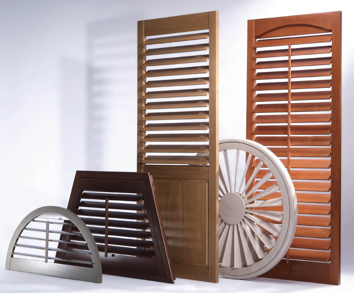 A group of wooden shutters are sitting next to each other