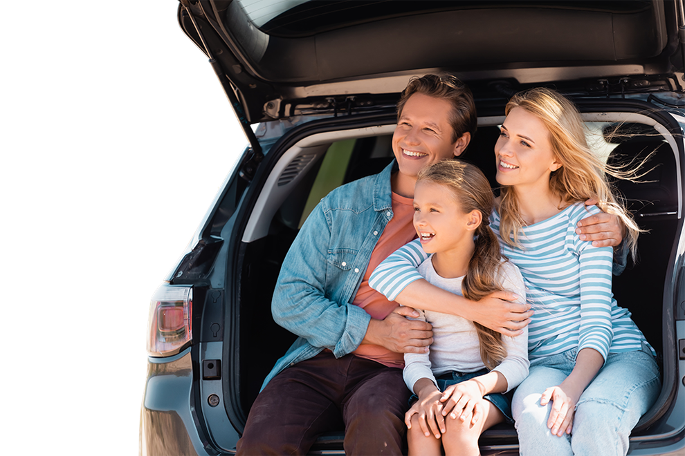 A family is sitting in the back of a car.